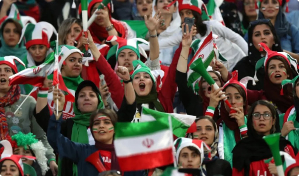 Female football fans celebrating in the stands